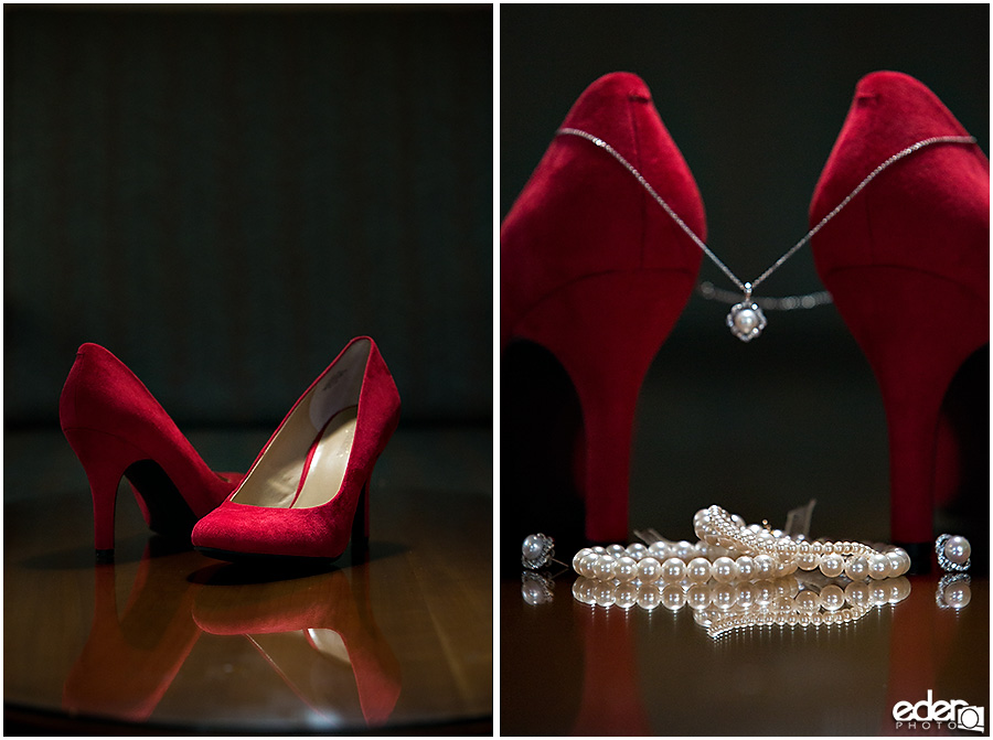 Red wedding shoes and pearl jewelry from wedding in Coronado, CA.