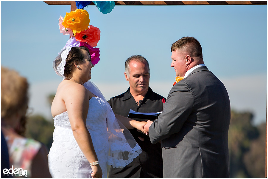 Ring exchange during ceremony at Coronado Community Center wedding. 