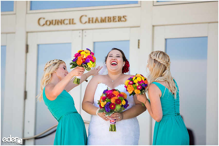 Bride and bridesmaids laughing in Coronado, CA.