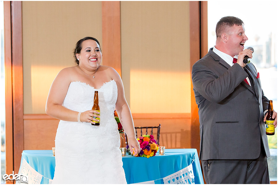 Bride and groom toast at wedding in Coronado, CA.