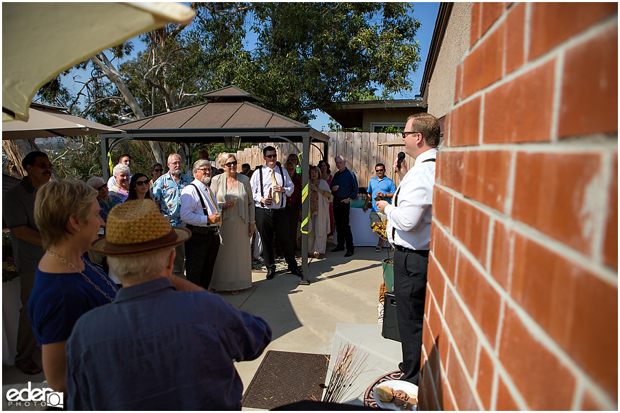 At-Home Wedding Photography back yard reception toasts.