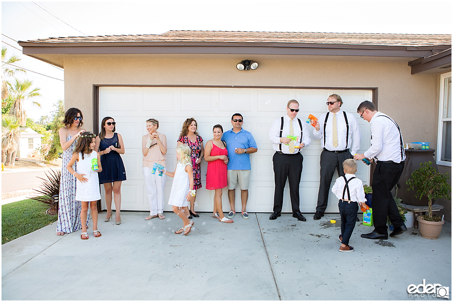 At-Home Wedding Photography back yard reception bubble exit.