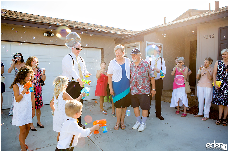 At-Home Wedding Photography back yard reception bubble exit.