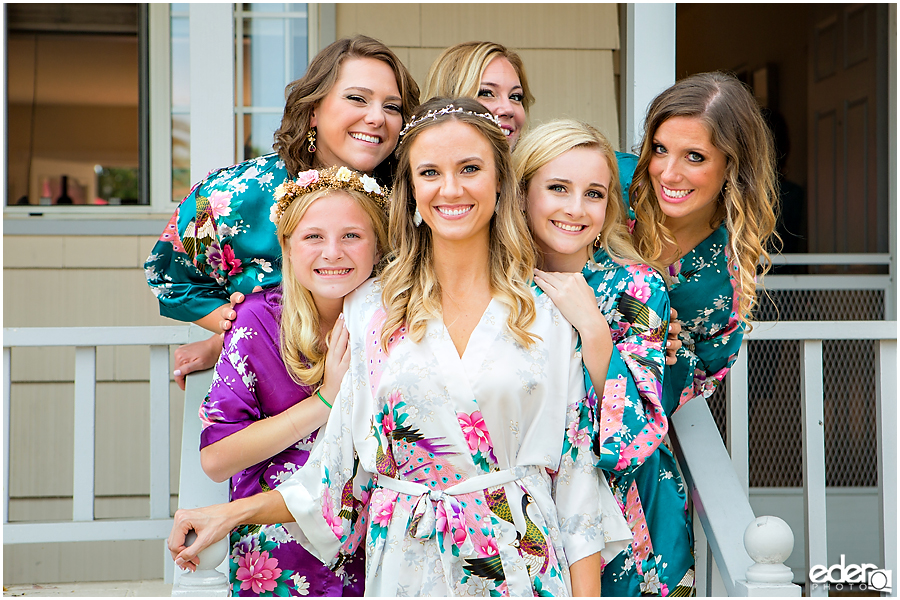 Bride and bridesmaids in matching robes.