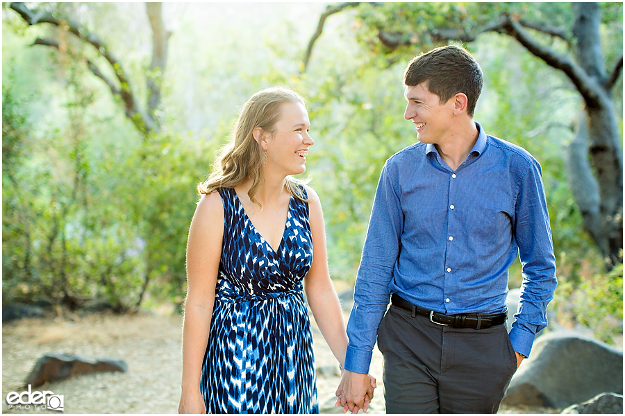 Mission Trails Engagement Session walking under trees.