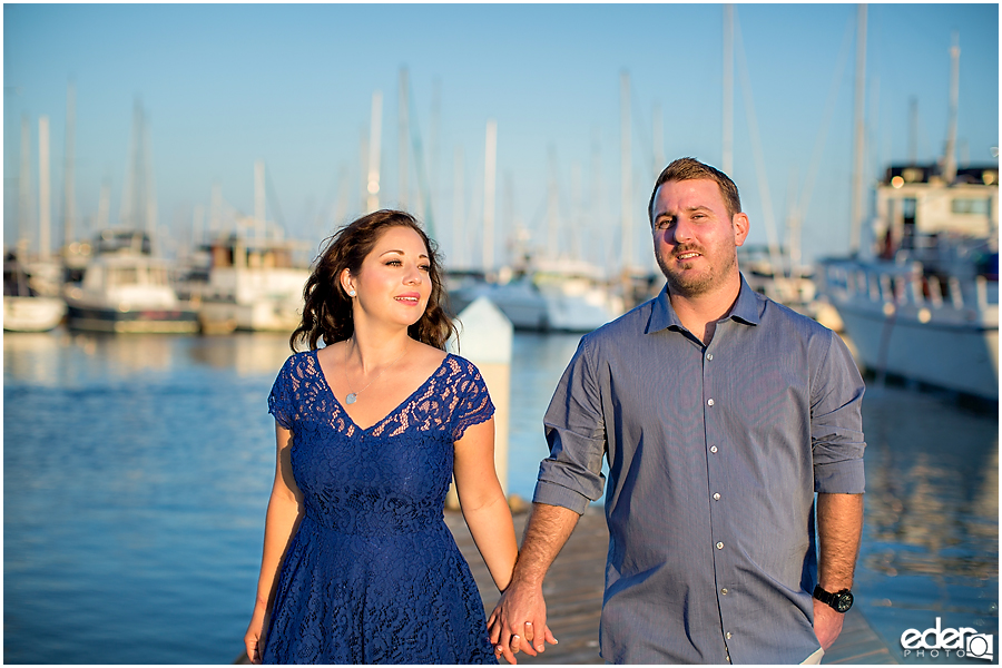 Walking on a dock during a Point Loma engagement session.