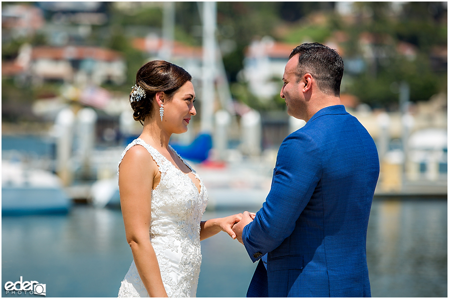 Rings exchanged during beach elopement at the Kona Kai Resort in San Diego, CA.