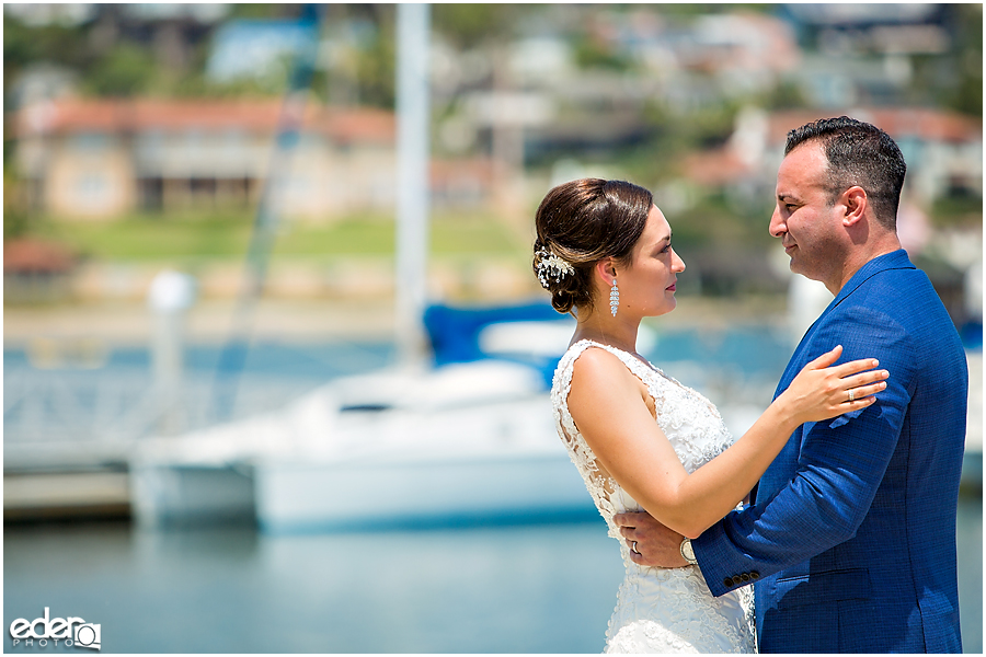 Couple looking in to each others eyes during beach elopement at the Kona Kai Resort in San Diego, CA.