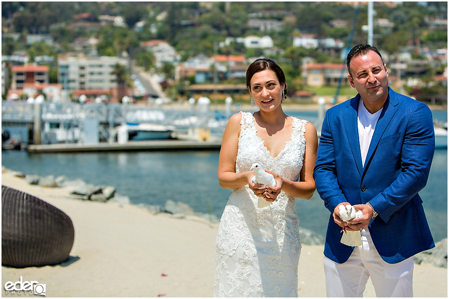 Dove release during beach elopement at the Kona Kai Resort in San Diego, CA.