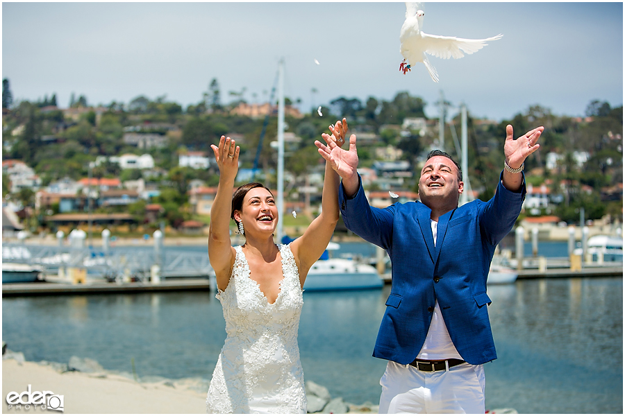 Doves being released during ceremony on the beach.