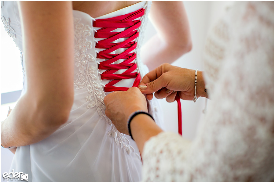 Baseball theme wedding dress with red lacing.