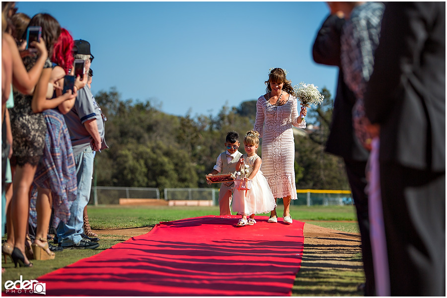 Flower girl at baseball themed wedding ceremony. 