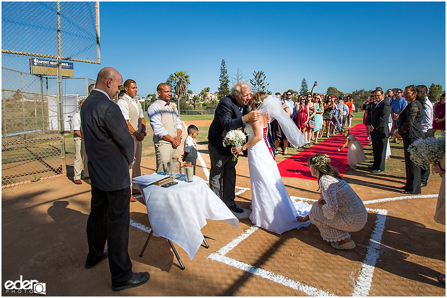 Bride and dad baseball themed wedding ceremony. 