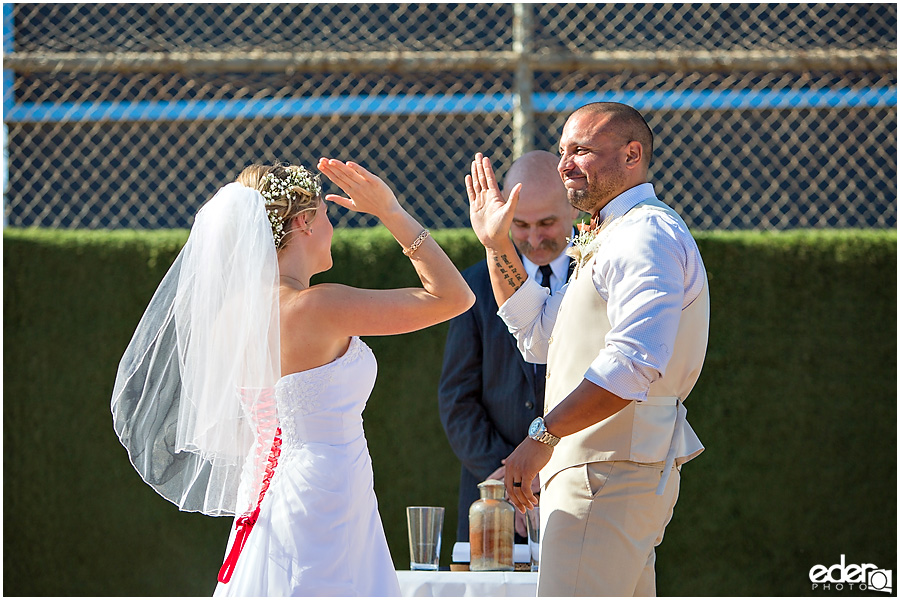 Celebration during baseball themed wedding ceremony. 