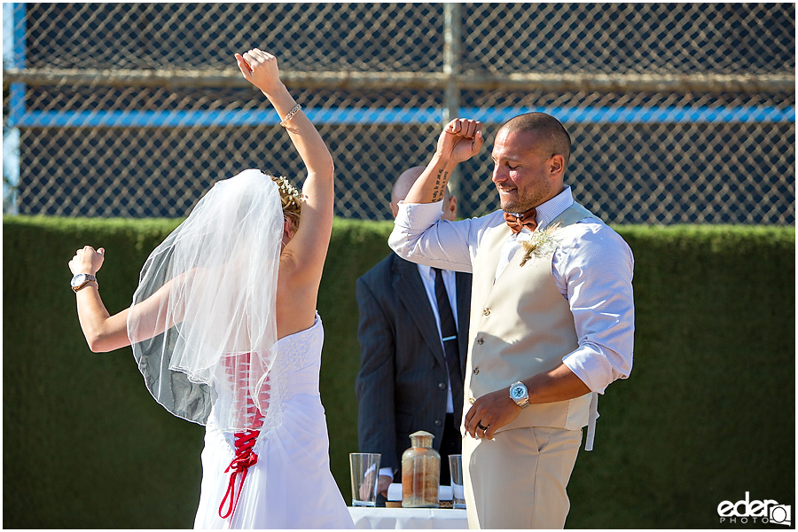 Celebration after baseball themed wedding ceremony. 