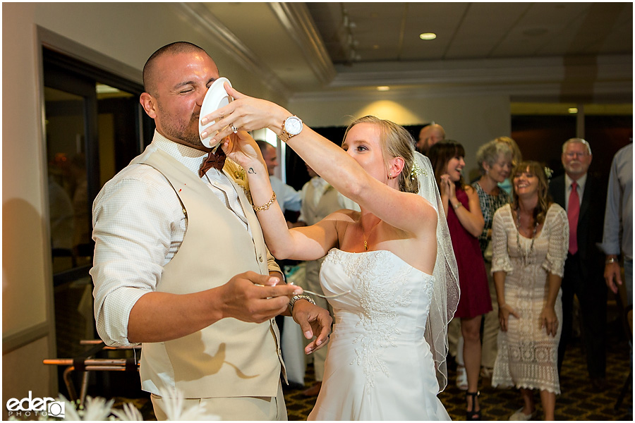 Wedding cake being smashed.