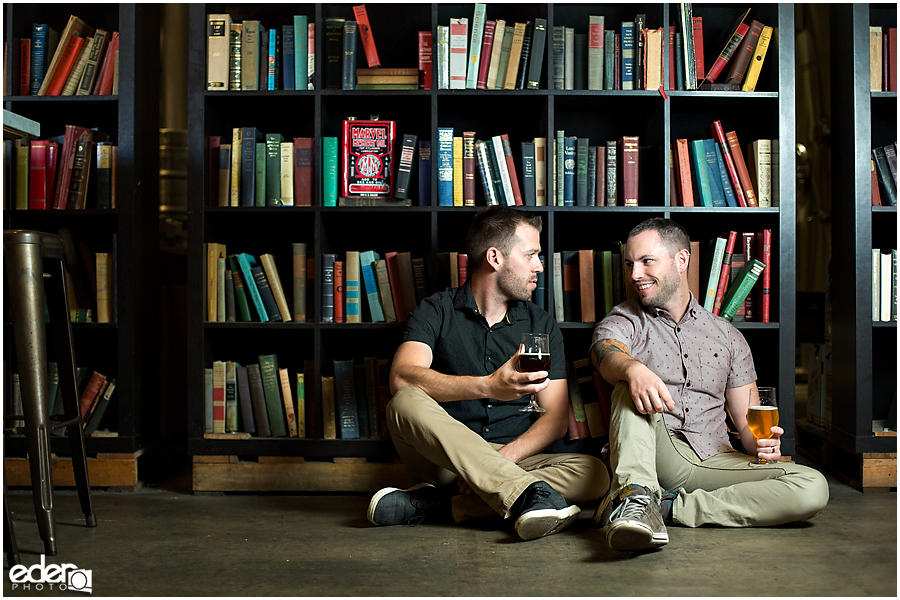 Engagement session in front of Modern Times book wall.