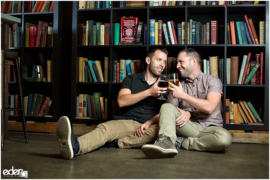 Engagement session in front of Modern Times book wall.