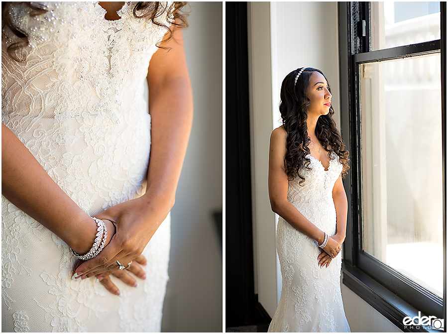 Bride standing at window at The US GRANT