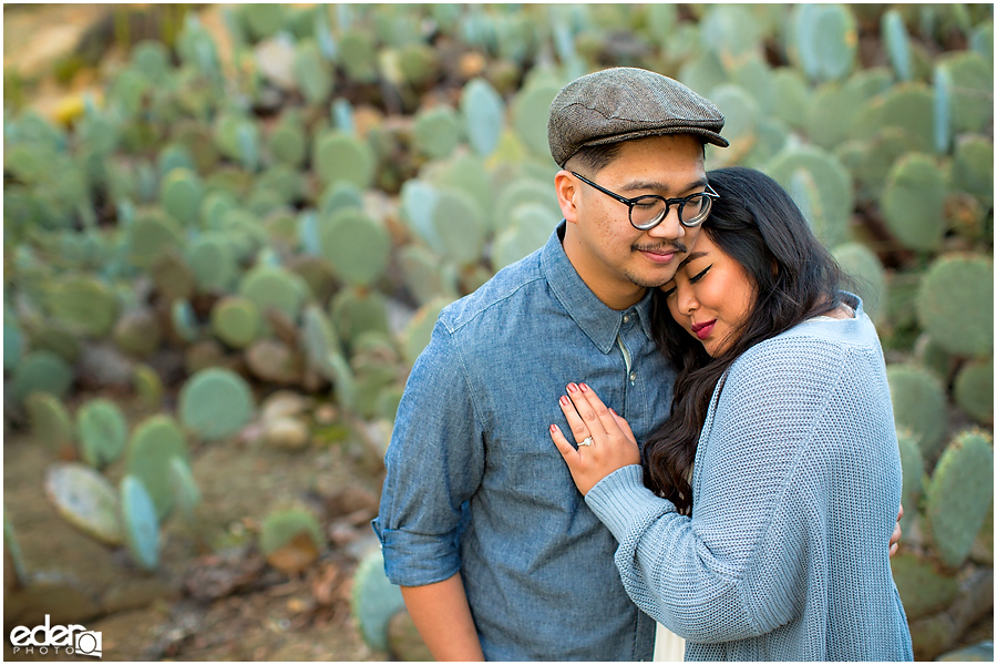 Balboa Park Engagement Session embracing in Cactus Garden.