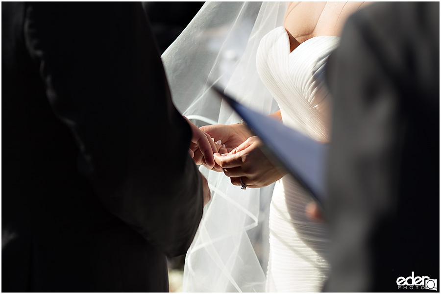 Ring exchange during wedding ceremony at Tom Ham's Lighthouse