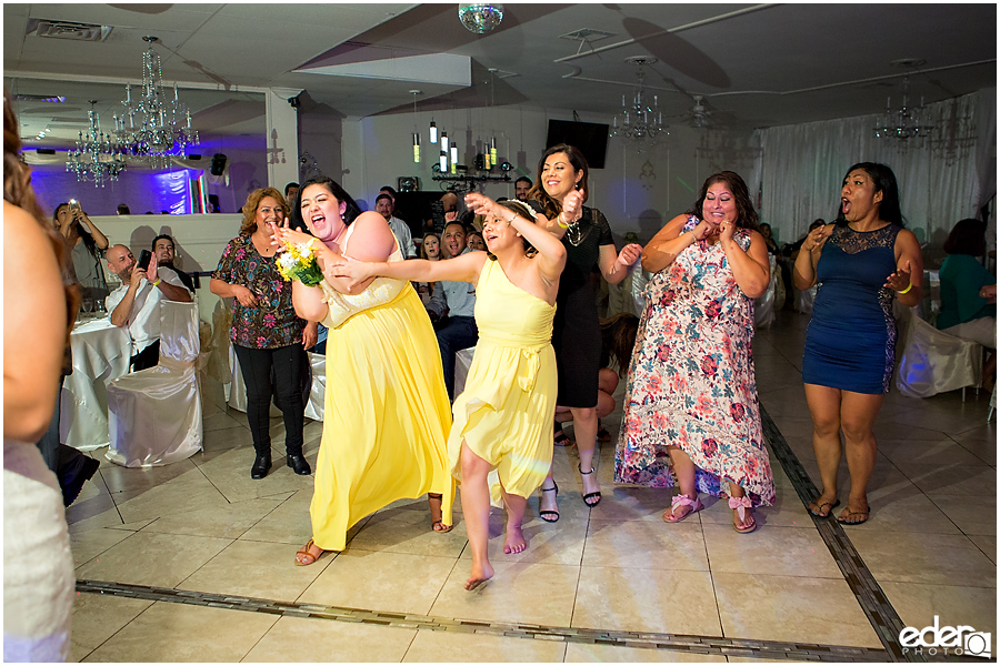 Bouquet toss at wedding reception at Just Java in Chula Vista.