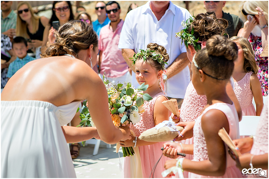 Pool wedding ceremony flower girl.