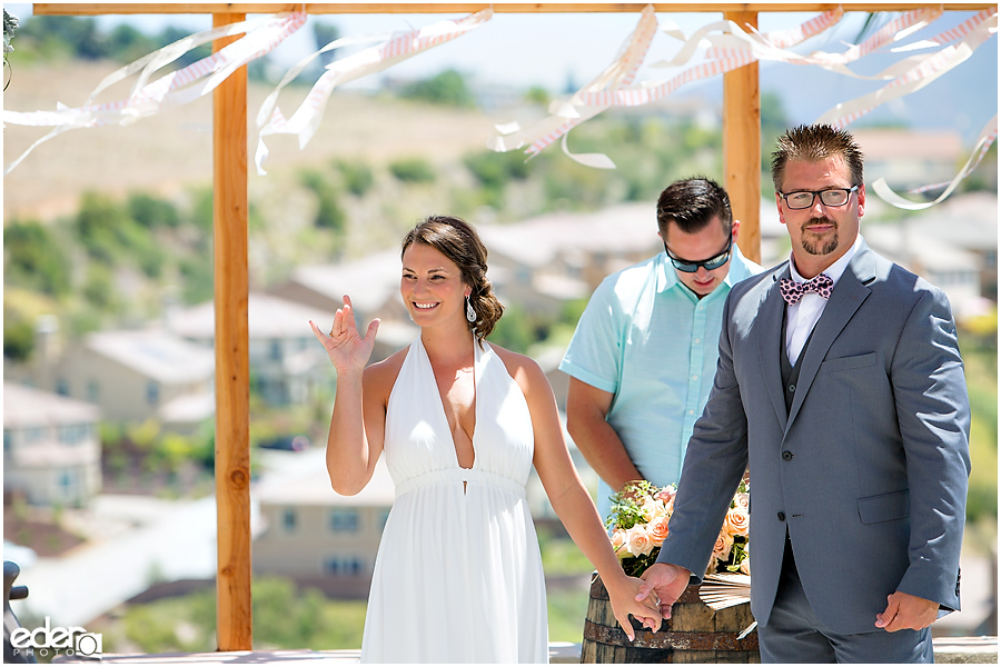 Pool wedding ceremony bride and groom.