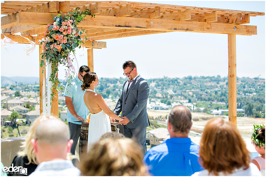 Pool wedding ceremony bride and groom.