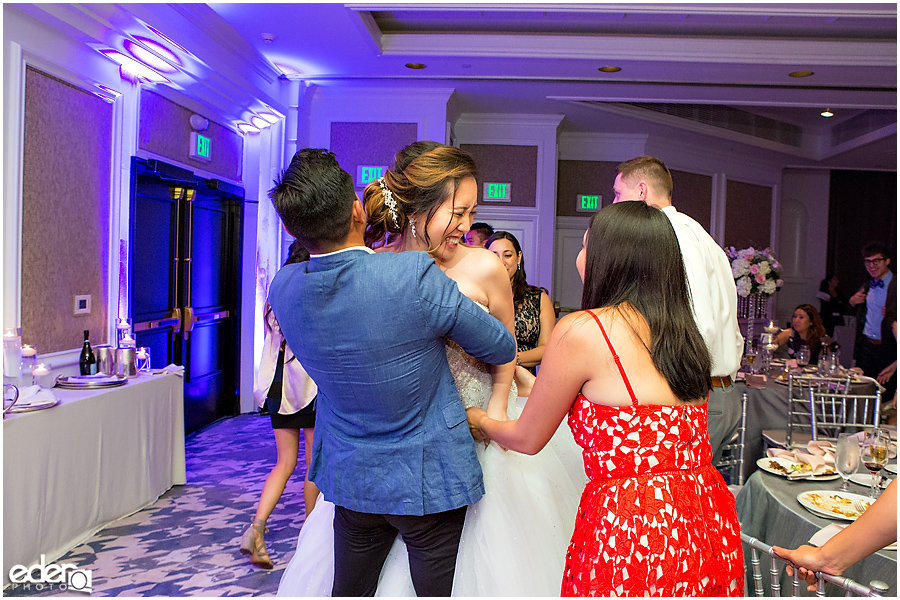 Wedding at The US Grant - photo of bride getting hugged.