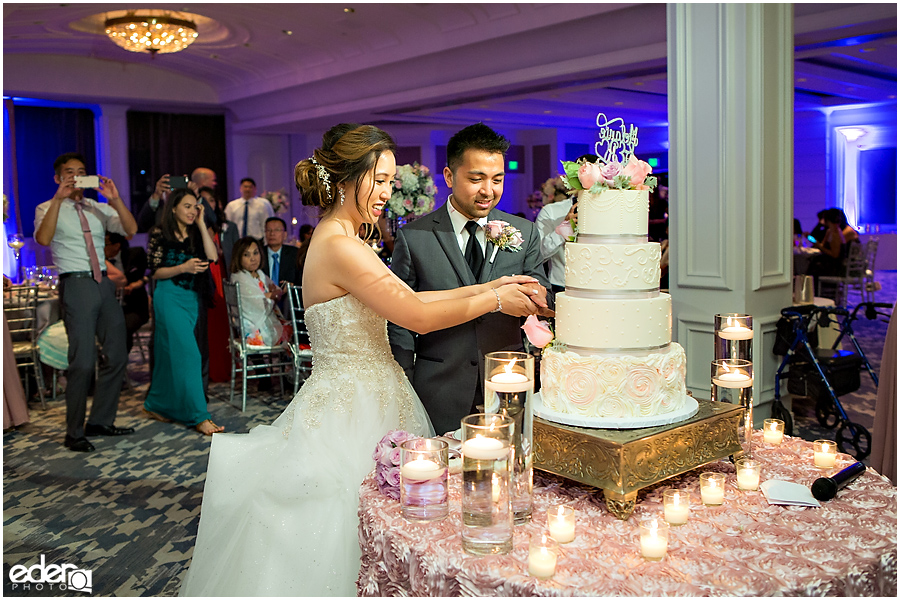 Wedding at The US Grant - photo of couple cutting the cake.