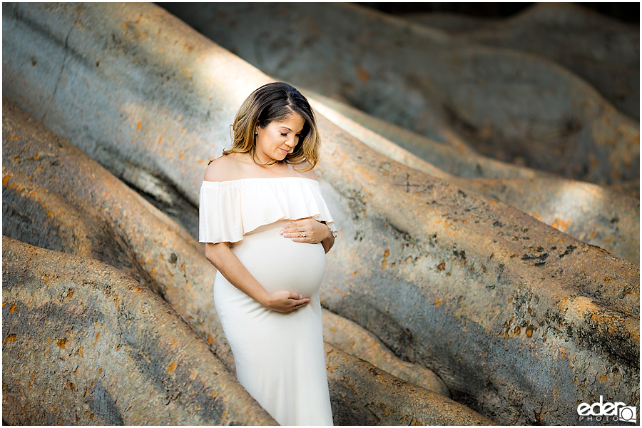 Balboa Park maternity session looking at belly.