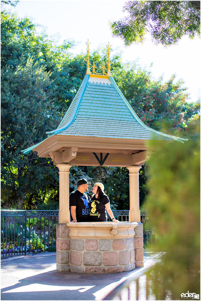 Disneyland Engagement Session next to wishing well.